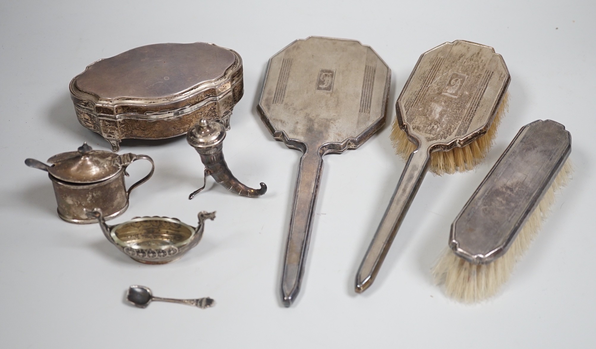 A George V silver mounted trinket box, Elkington & Co, Birmingham, 1918, 13.1cm, a silver mustard pot, two Scandinavian 925 condiments, two silver mounted scent bottles, hatpins and hatpin stand and a silver mounted thre
